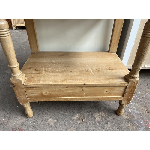 33 - A Victorian pine rectangular two tier side table with lower drawer