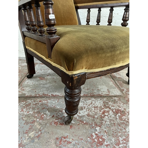 34 - A Victorian mahogany and fabric upholstered armchair