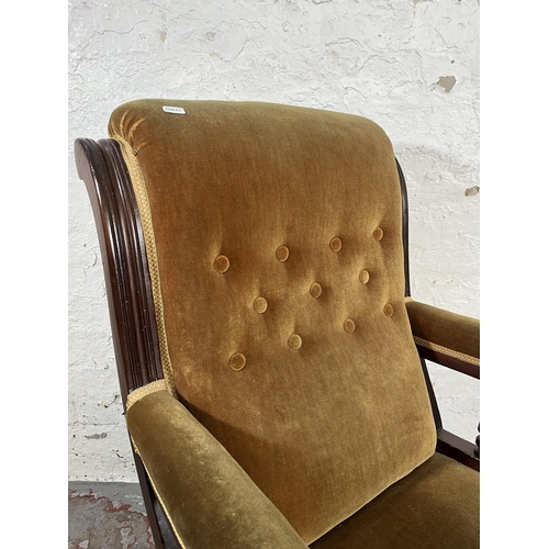 34 - A Victorian mahogany and fabric upholstered armchair