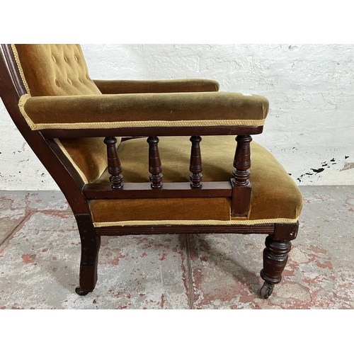 34 - A Victorian mahogany and fabric upholstered armchair