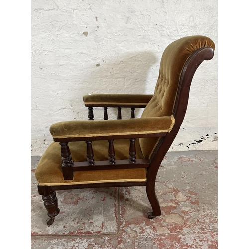 34 - A Victorian mahogany and fabric upholstered armchair