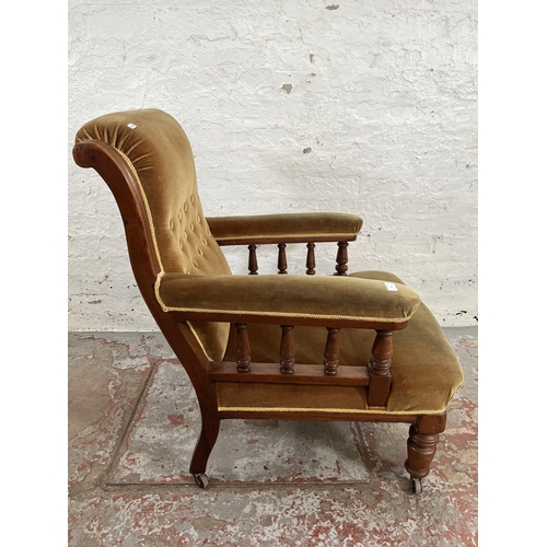 35 - A Victorian mahogany and fabric upholstered armchair