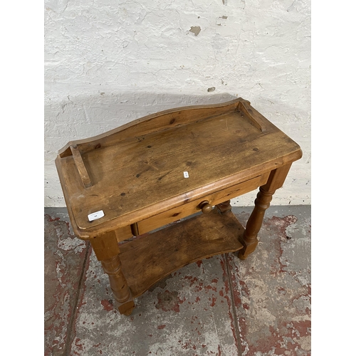 44 - A Victorian style pine two tier side table with single drawer