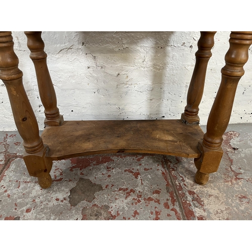 44 - A Victorian style pine two tier side table with single drawer