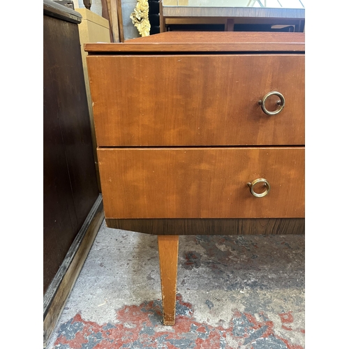 46 - A mid 20th century teak dressing table with four drawers and upper mirror