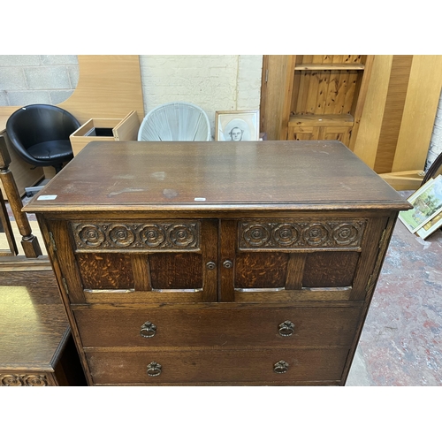 49 - A Crown Ay carved oak tallboy chest of drawers - approx. 123cm high x 87cm wide x 48cm deep