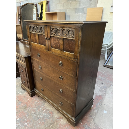 49 - A Crown Ay carved oak tallboy chest of drawers - approx. 123cm high x 87cm wide x 48cm deep