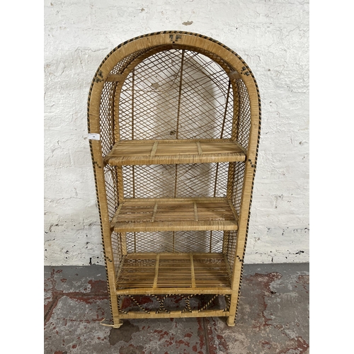 54 - A mid 20th century wicker three tier open bookcase