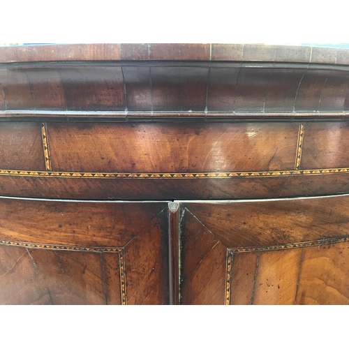 56 - A Georgian inlaid mahogany bow front wall mountable corner cabinet