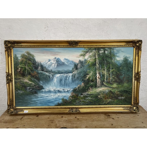 211 - A gilt framed oil on canvas of a landscape scene by R. Danford - approx. 73cm high x 134cm wide