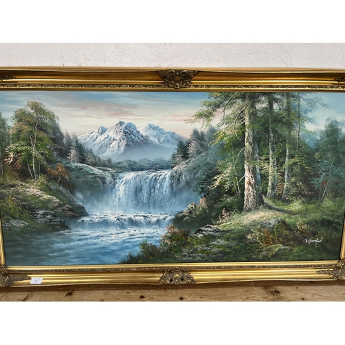 211 - A gilt framed oil on canvas of a landscape scene by R. Danford - approx. 73cm high x 134cm wide