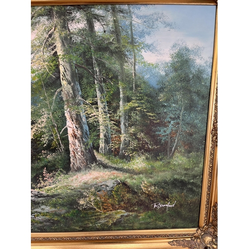 211 - A gilt framed oil on canvas of a landscape scene by R. Danford - approx. 73cm high x 134cm wide