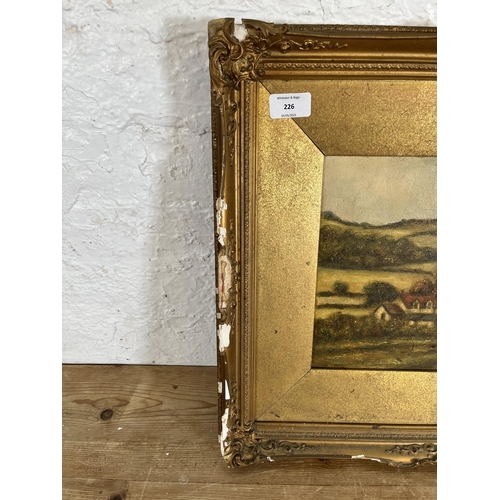 226 - A gilt framed oil painting of a landscape scene, signed Edward Lake - approx. 46cm high x 56cm wide