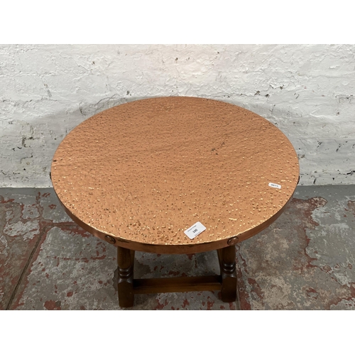 100 - A beech and copper top circular side table