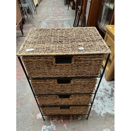 103 - A wicker and black metal chest of four drawers