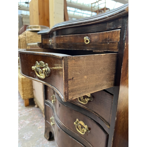 106 - A Georgian style mahogany serpentine chest of four drawers with brushing slide - approx. 75cm high x... 