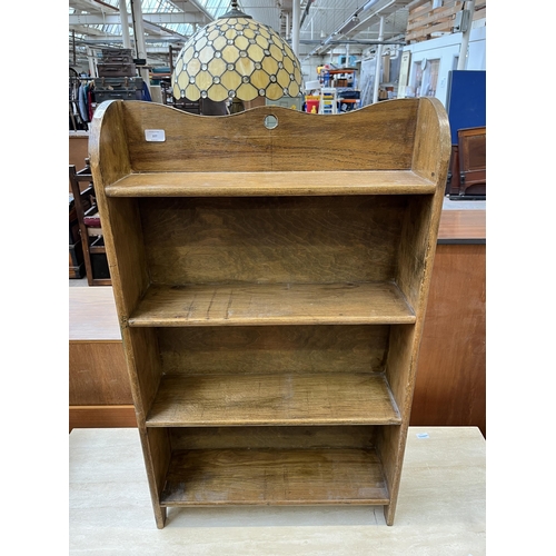 107 - An Arts and Crafts style oak four tier bookcase, circa mid 20th century