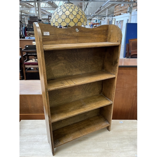 107 - An Arts and Crafts style oak four tier bookcase, circa mid 20th century