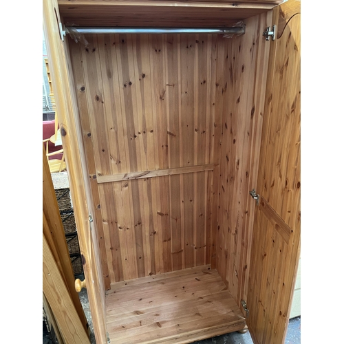 115 - A modern pine double wardrobe - approx. 179cm high x 90cm wide x 54cm deep