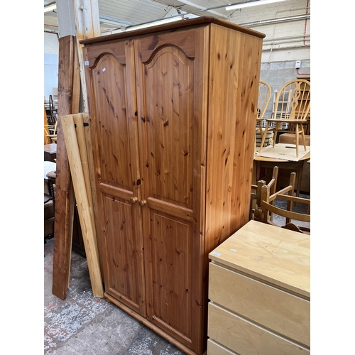 115 - A modern pine double wardrobe - approx. 179cm high x 90cm wide x 54cm deep