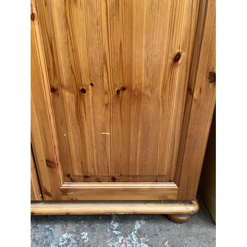 115 - A modern pine double wardrobe - approx. 179cm high x 90cm wide x 54cm deep