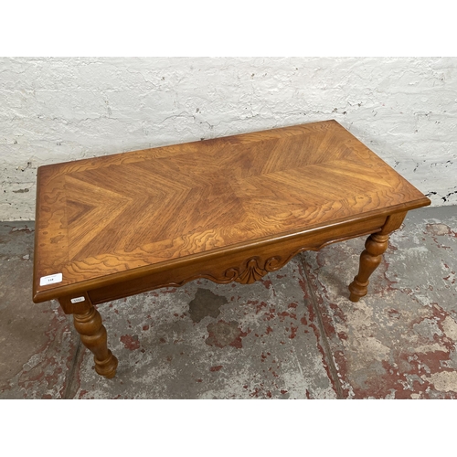 118 - A French style oak parquet top rectangular coffee table