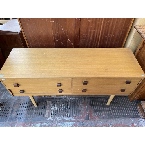 136 - A mid 20th century oak dressing table with four drawers