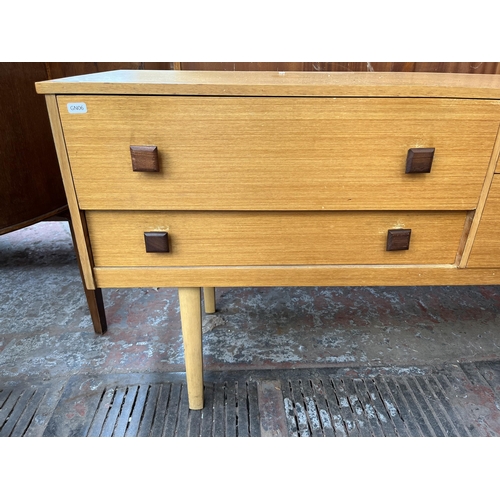 136 - A mid 20th century oak dressing table with four drawers