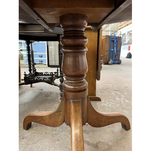 140 - A Georgian oak circular tilt top occasional table on tripod pedestal support