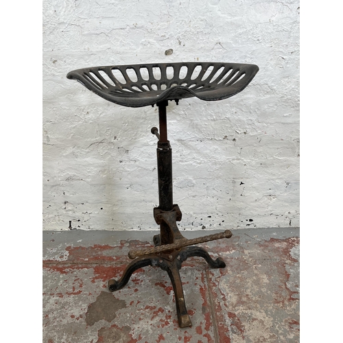 143 - A cast iron tractor seat stool