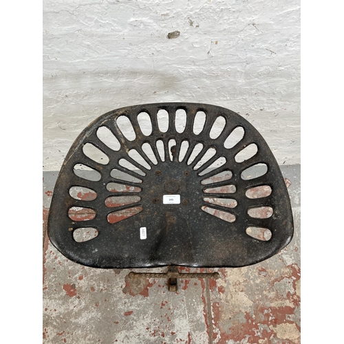 143 - A cast iron tractor seat stool