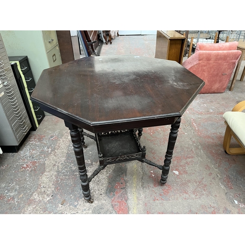 144 - A late 19th/early 20th century mahogany octagonal occasional table with lower shelf