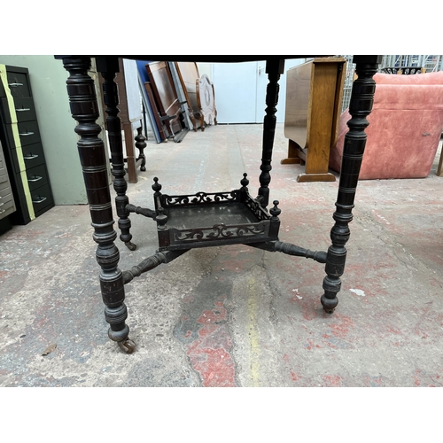 144 - A late 19th/early 20th century mahogany octagonal occasional table with lower shelf