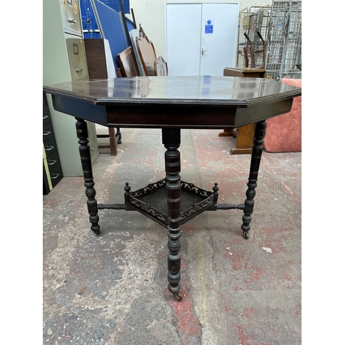 144 - A late 19th/early 20th century mahogany octagonal occasional table with lower shelf