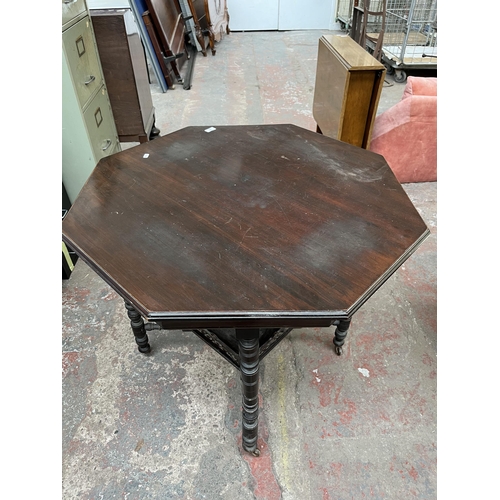 144 - A late 19th/early 20th century mahogany octagonal occasional table with lower shelf