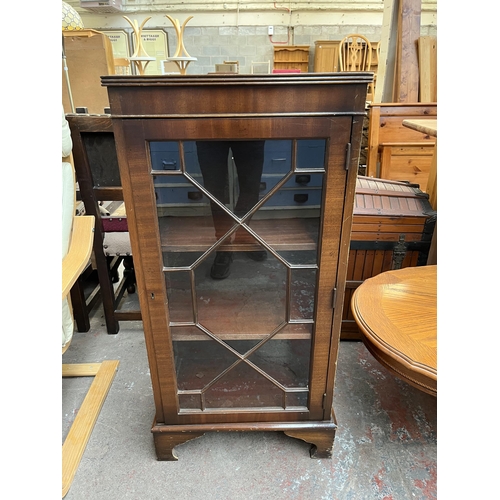 146 - A Georgian style mahogany astral glazed display cabinet with bracket supports