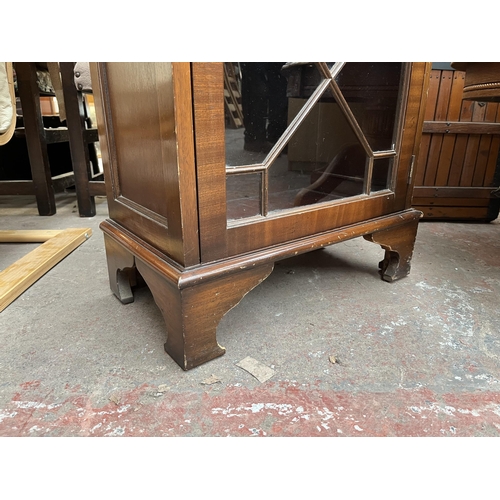 146 - A Georgian style mahogany astral glazed display cabinet with bracket supports