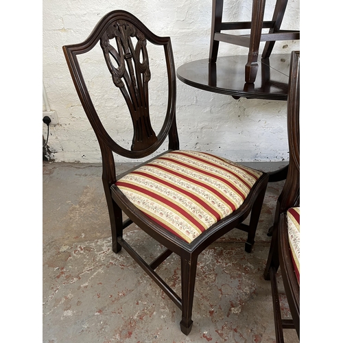 152 - A Georgian style mahogany drop leaf oval dining table and six Hepplewhite style dining chairs