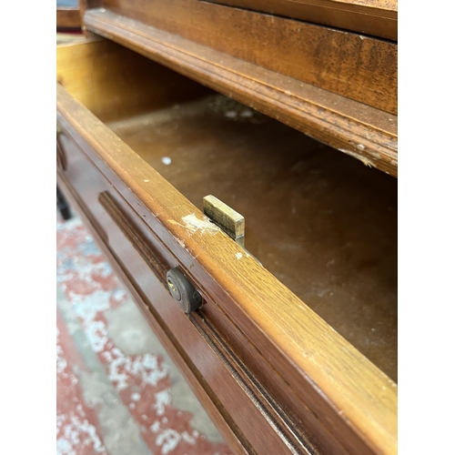 155 - A mahogany bureau with three drawers and fall front