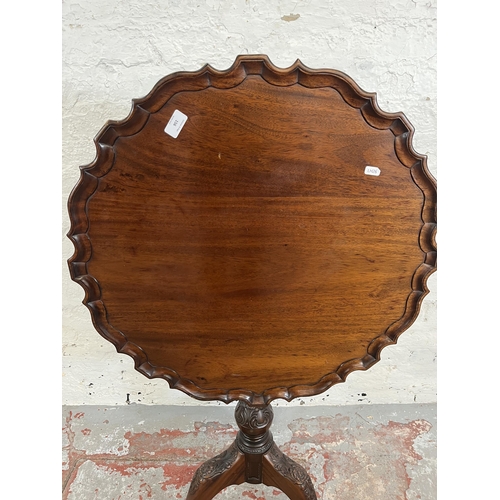 156 - A Georgian style mahogany pie crust edge tilt top occasional table with carved tripod pedestal and b... 