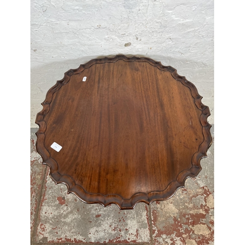 156 - A Georgian style mahogany pie crust edge tilt top occasional table with carved tripod pedestal and b... 