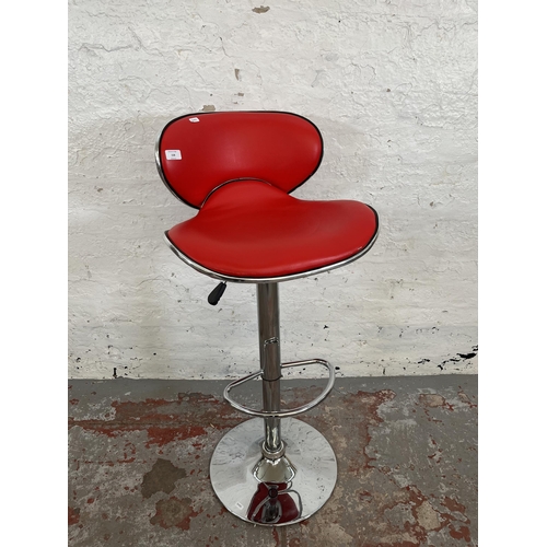 158 - A modern red leatherette and chrome plated kitchen barstool retailed by Actona, Denmark