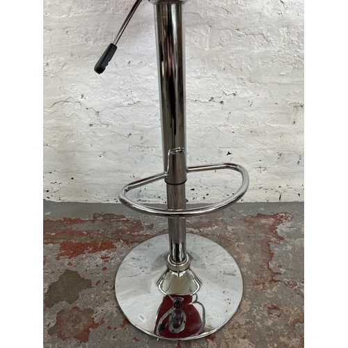 158 - A modern red leatherette and chrome plated kitchen barstool retailed by Actona, Denmark