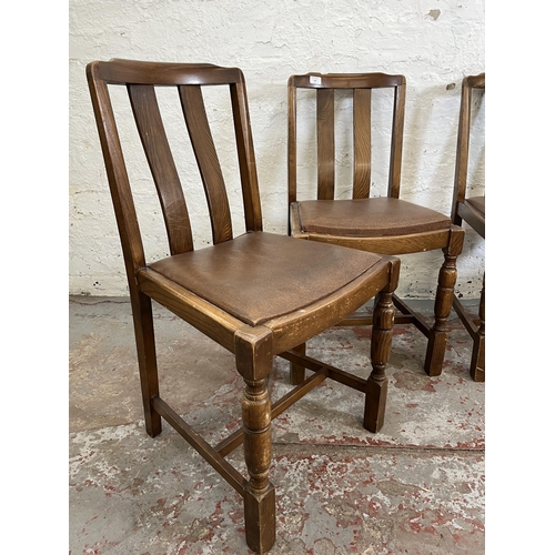 160 - Four oak dining chairs with brown leatherette upholstery