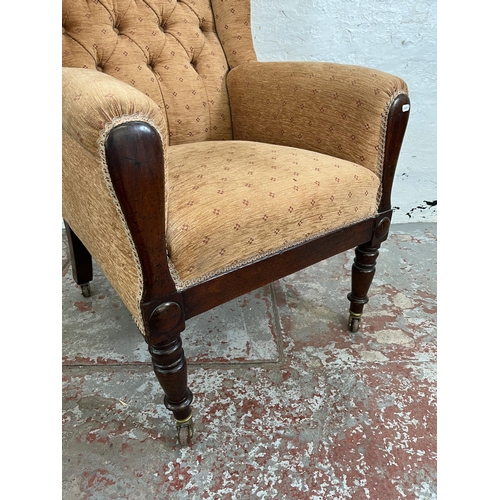 161 - A late 19th/early 20th century mahogany and fabric upholstered wing back armchair