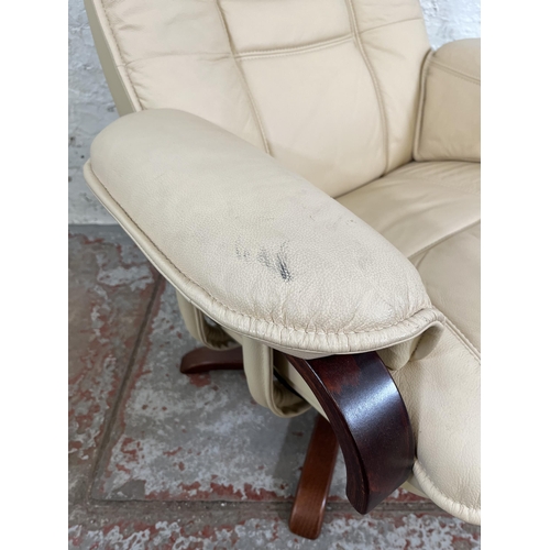 162 - A Stressless style cream leather swivel reclining armchair and matching footstool