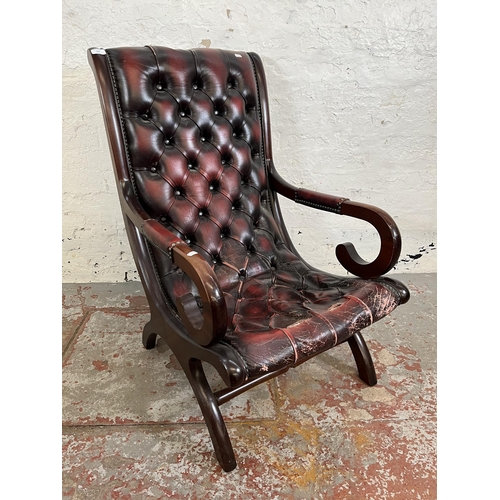 163 - A mahogany and oxblood leather Chesterfield slipper chair