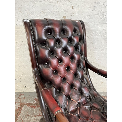 163 - A mahogany and oxblood leather Chesterfield slipper chair