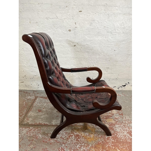 163 - A mahogany and oxblood leather Chesterfield slipper chair