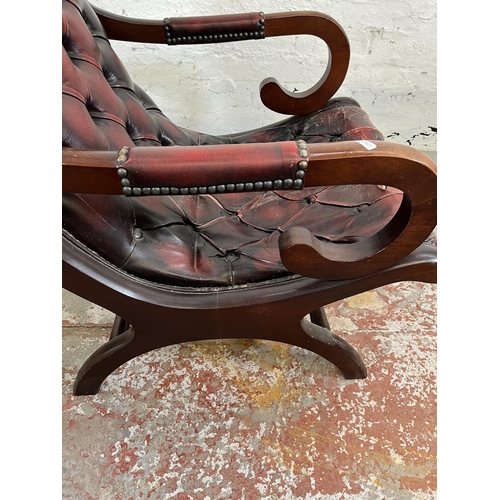 163 - A mahogany and oxblood leather Chesterfield slipper chair